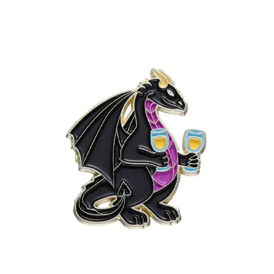 A black enamel pin against a white background. The pin depicts a black dragon with a purple belly, holding two wine glasses.
