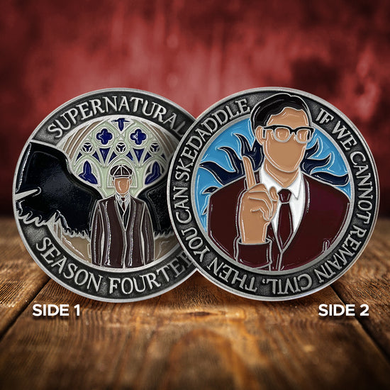 Two challenge coins side by side on a wooden table. The left coin depicts a man in a black suit with black angel wings, in front of stained glass window. Around the edge is raised text saying Supernatural Season Fourteen. The right coin shows a man in a brown sweater and tie wearing glasses, holding a finger up admonishingly. Behind him is a blue background with black sun beams. Around the edge is raised text saying "If we cannot remain civil, then you can skedaddle."
