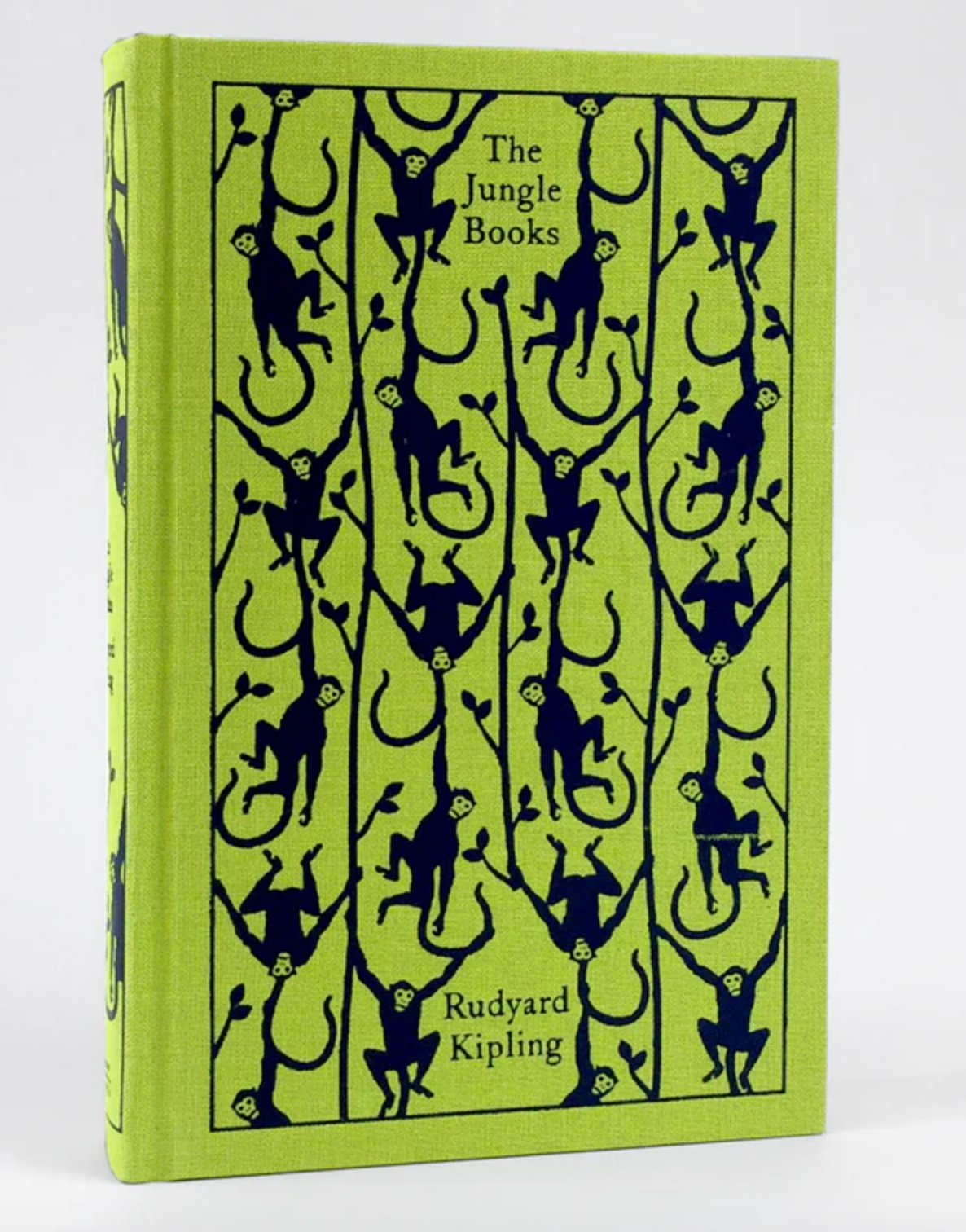 A bright green book against a white background. The book cover has a pattern of monkeys drawn across it. Black text at the top says "The Jungle Books: Rudyard Kipling"