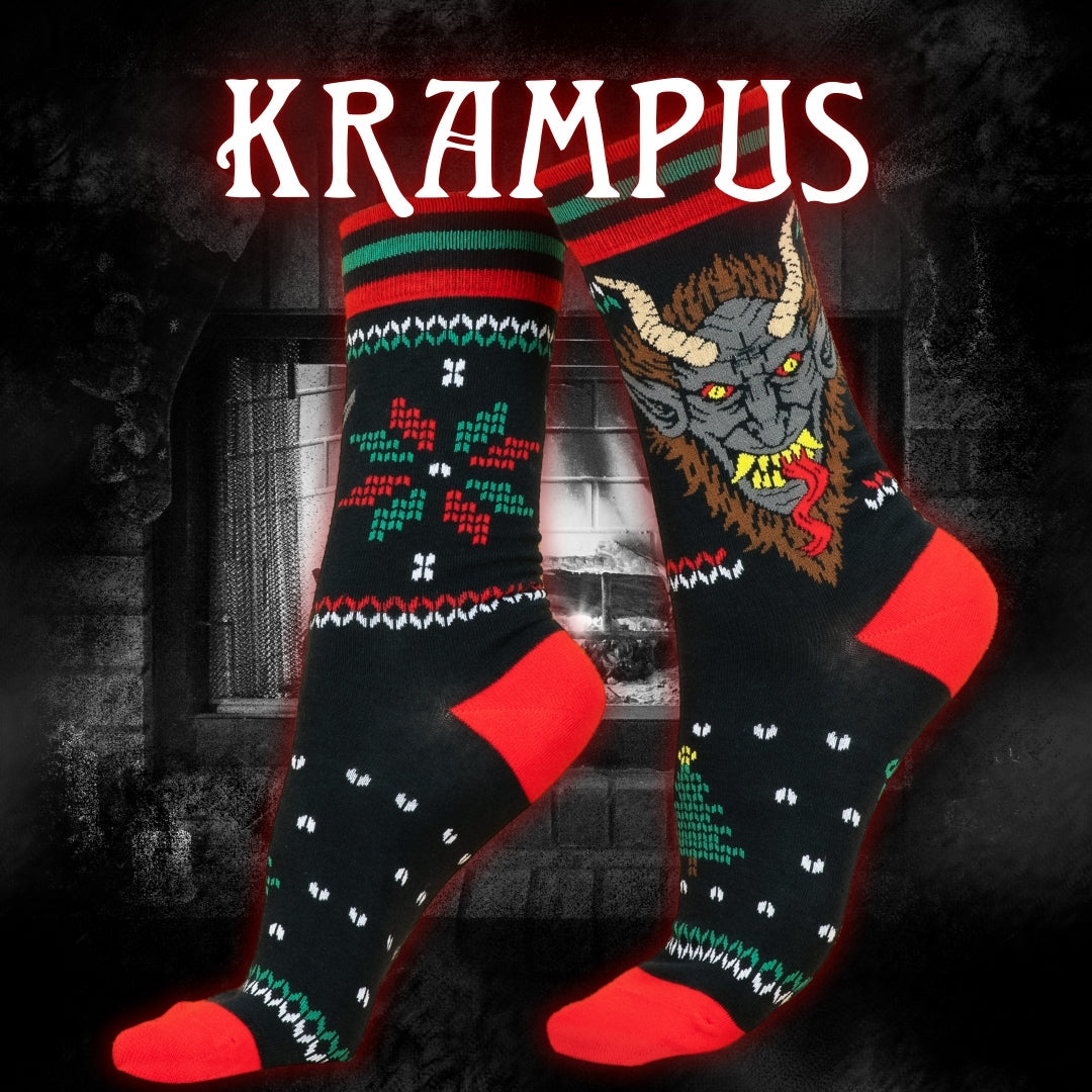 Two socks with Krampus design on a dark background