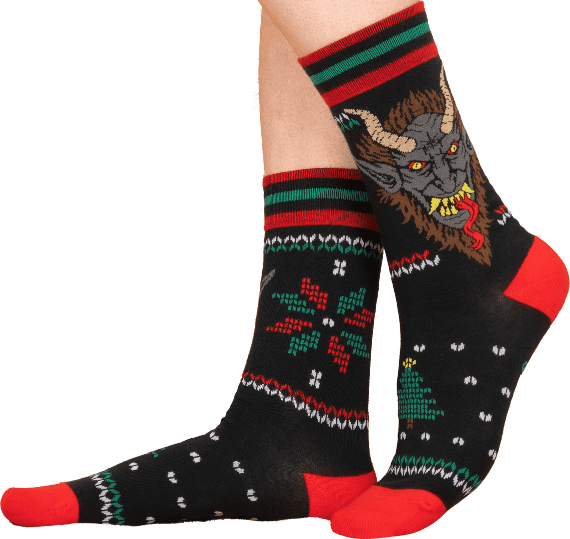 Socks with a demon design and red, green, and black stripes on a white background