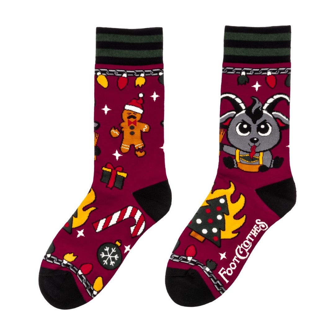 Colorful socks with cartoon Krampus design on a white background