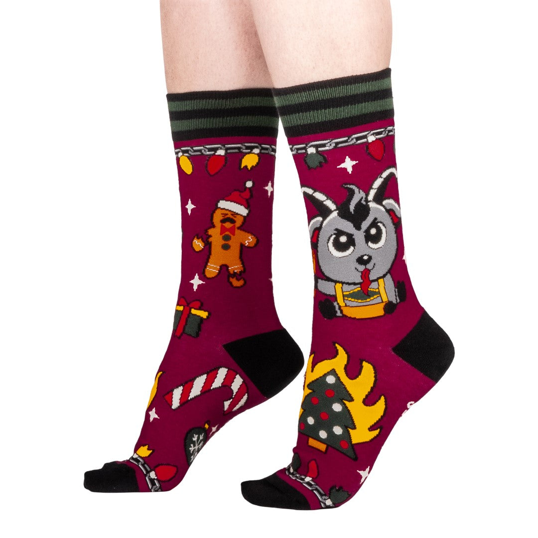 Colorful socks with cartoon Krampus design on a white background