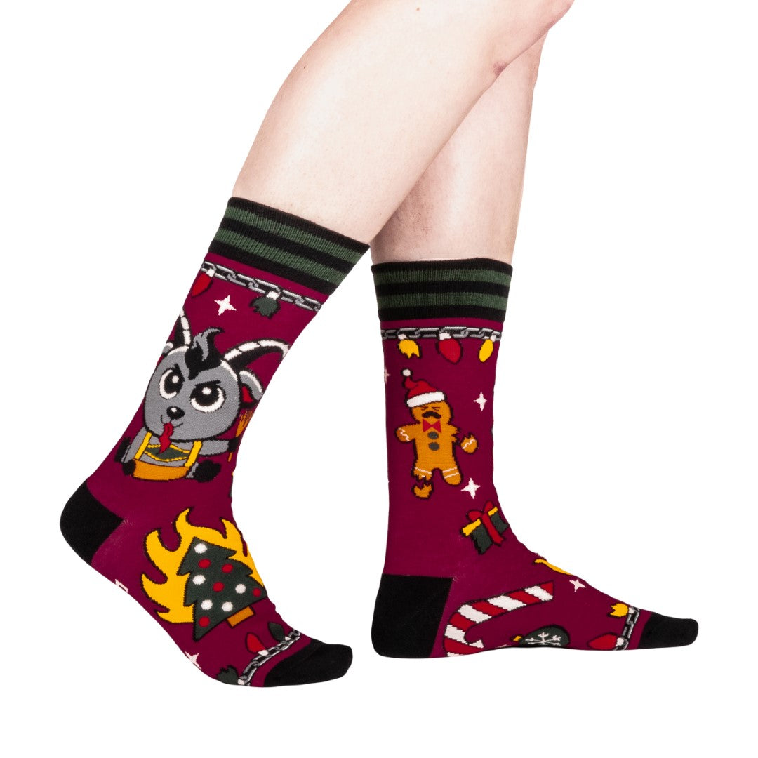 Colorful socks with cartoon Krampus design on a white background