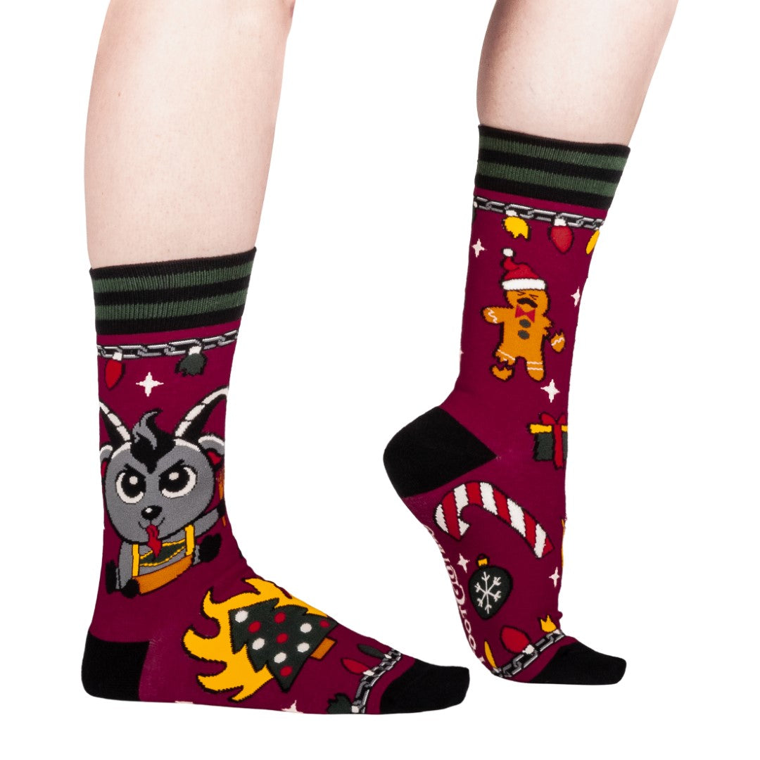 Colorful socks with cartoon Krampus design on a white background