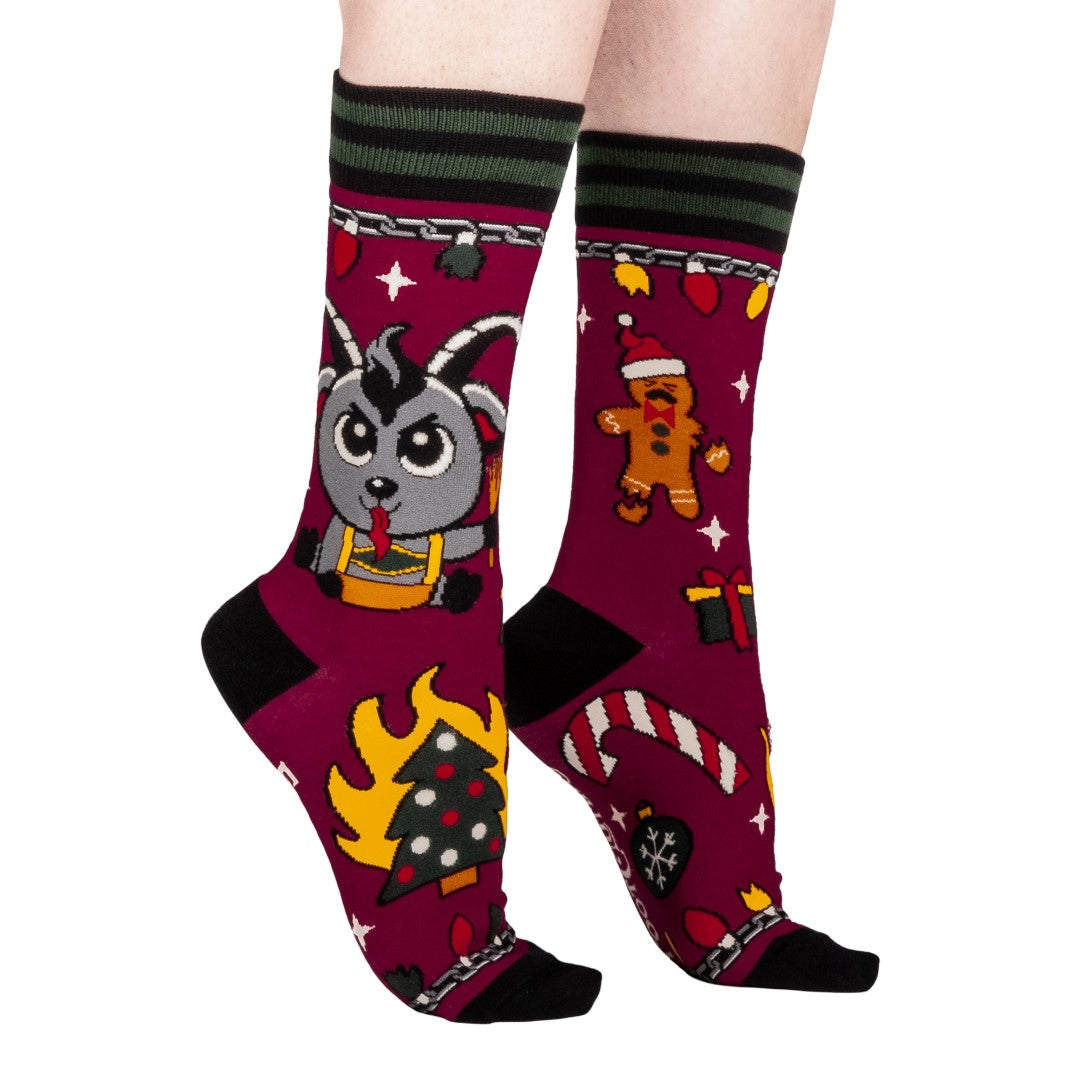 Colorful socks with cartoon Krampus design on a white background