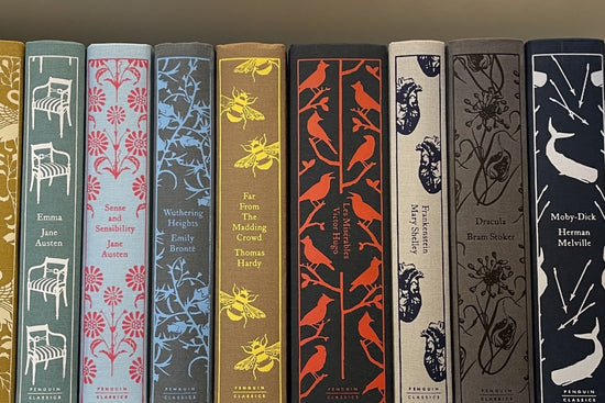The spines of several Penguin Clothbound Classics, including EMMA, SENSE AND SENSIBILITY, WUTHERING HEIGHTS, FRANKENSTEIN, and DRACULA
