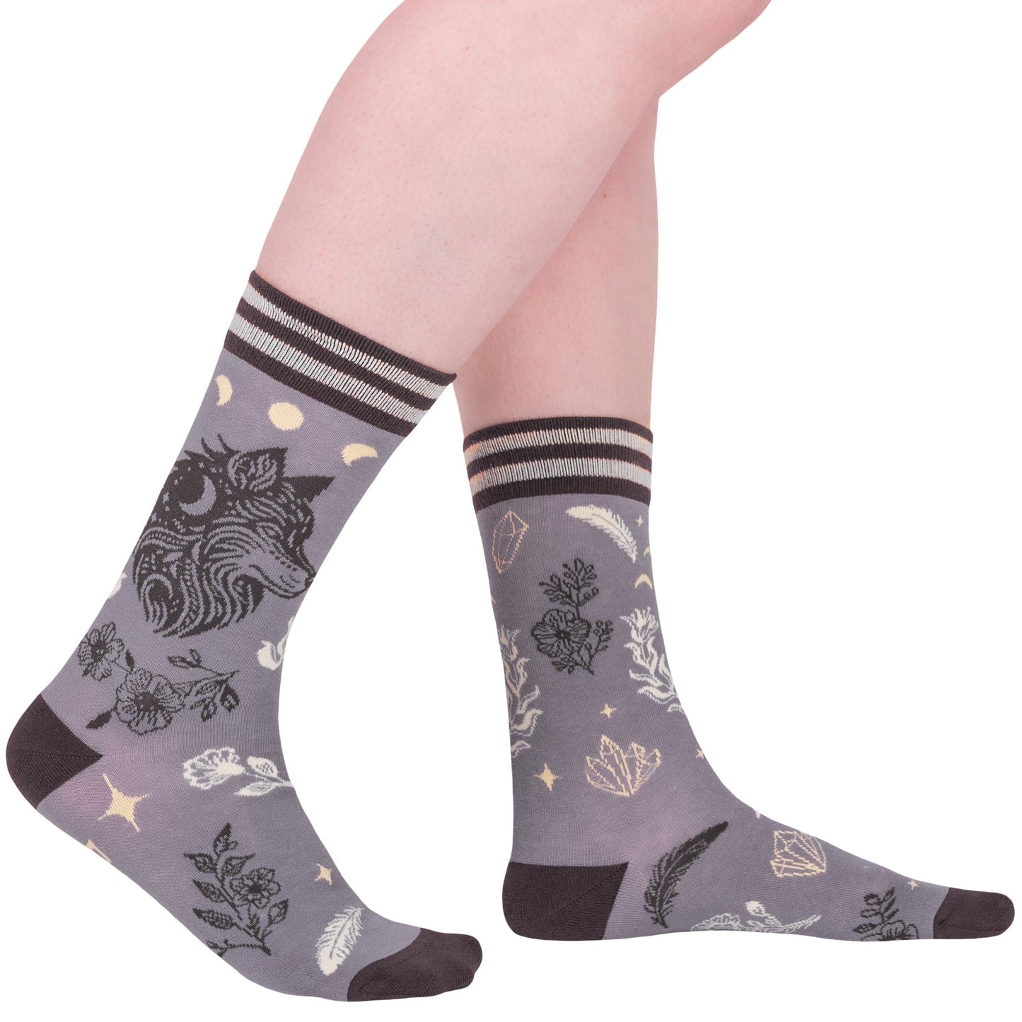 Gray socks with nature-themed design worn by a person on a white background