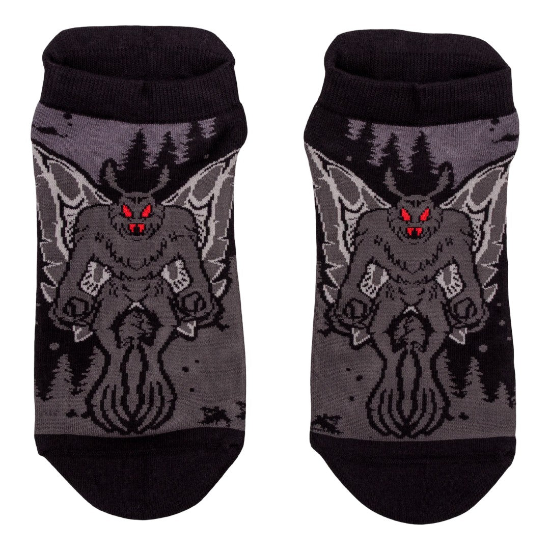 Pair of socks with a Mothman design on a white background