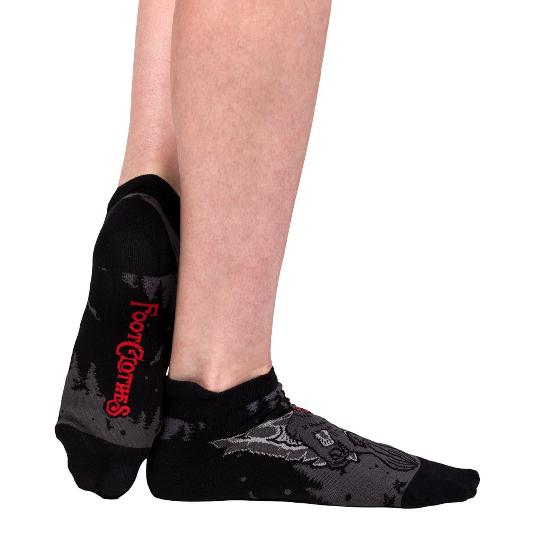 Black ankle socks with red text on a white background