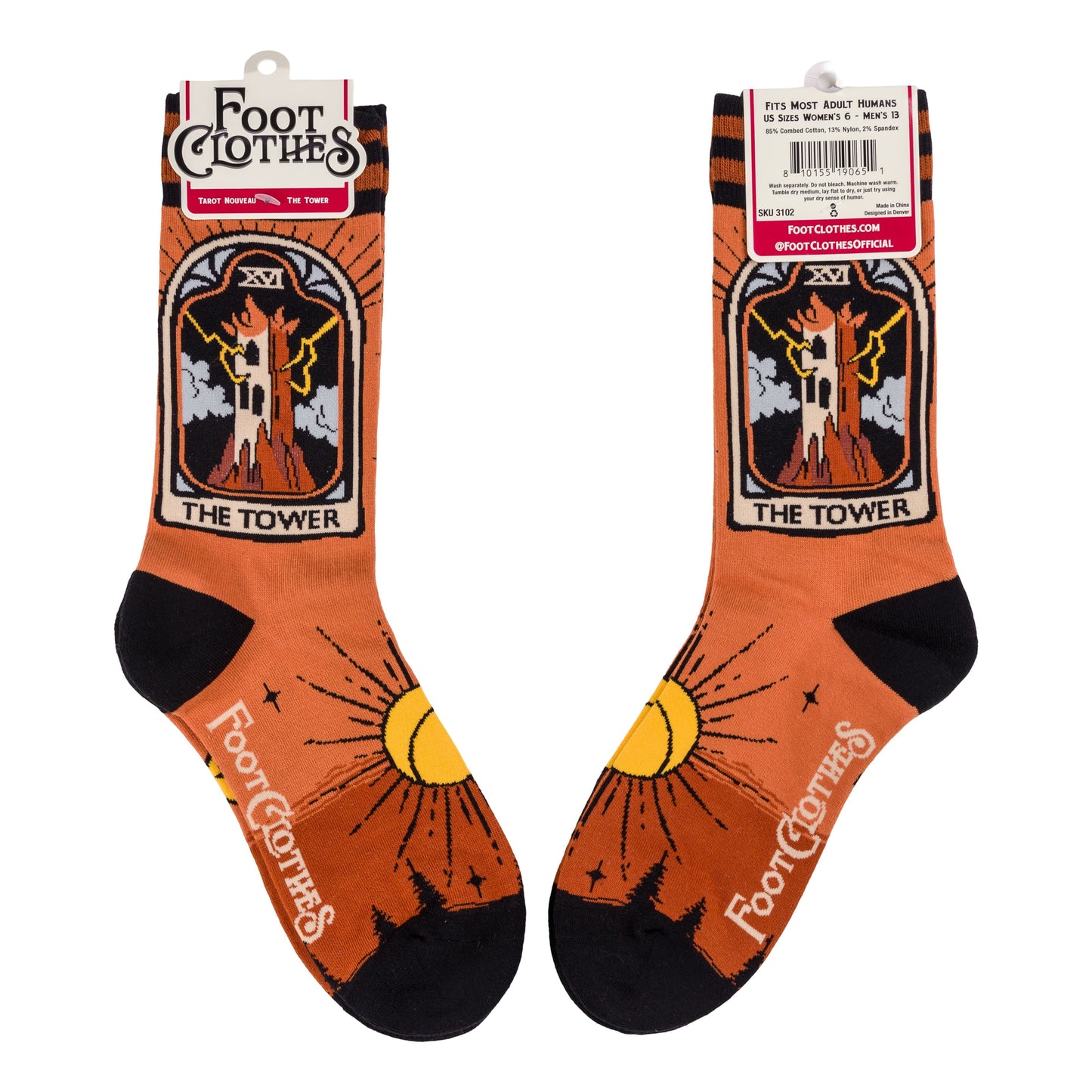 Pair of orange socks with 'The Tower' tarot card design and 'Foot Clothes' branding on a white background.