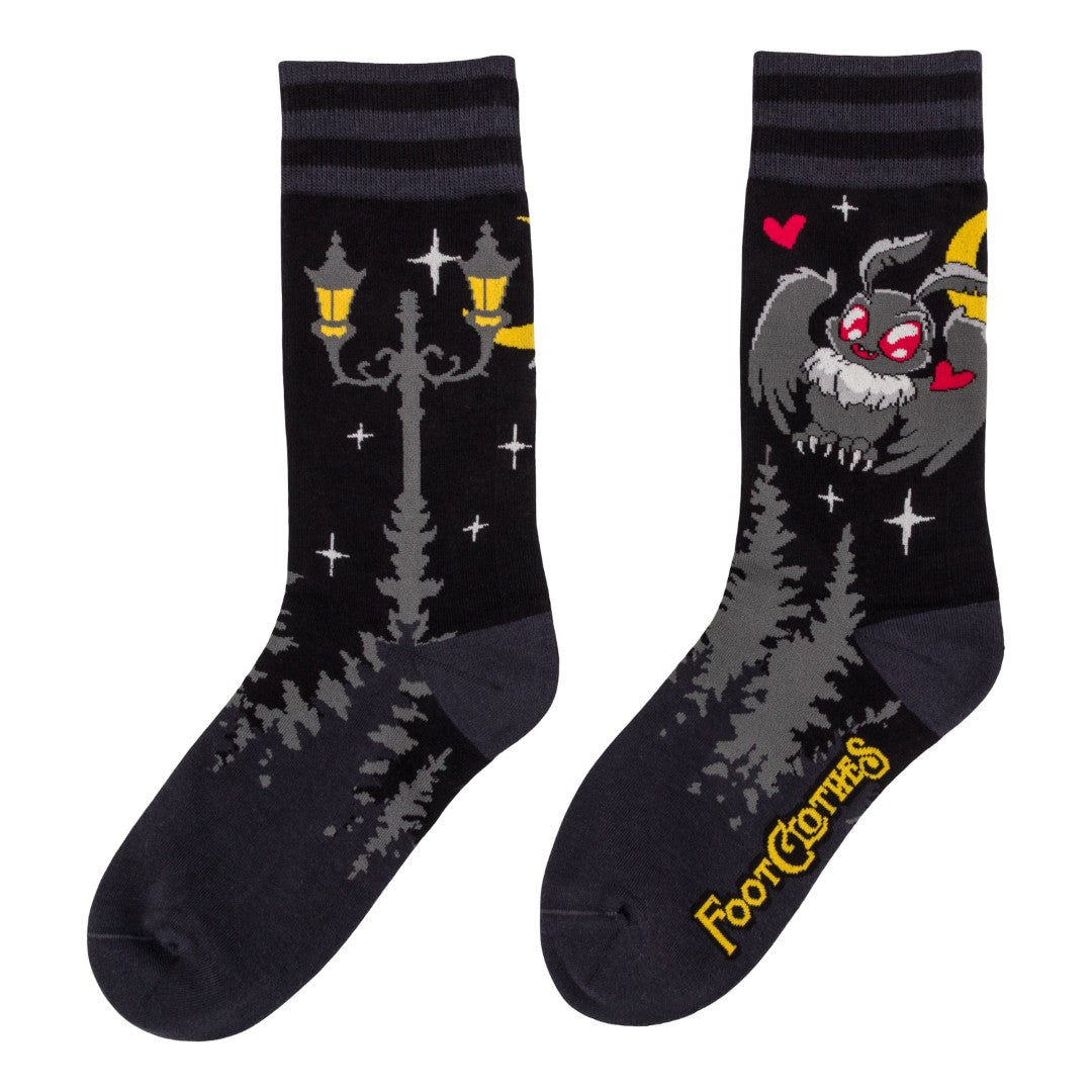 Pair of socks with cartoon character design on a white background