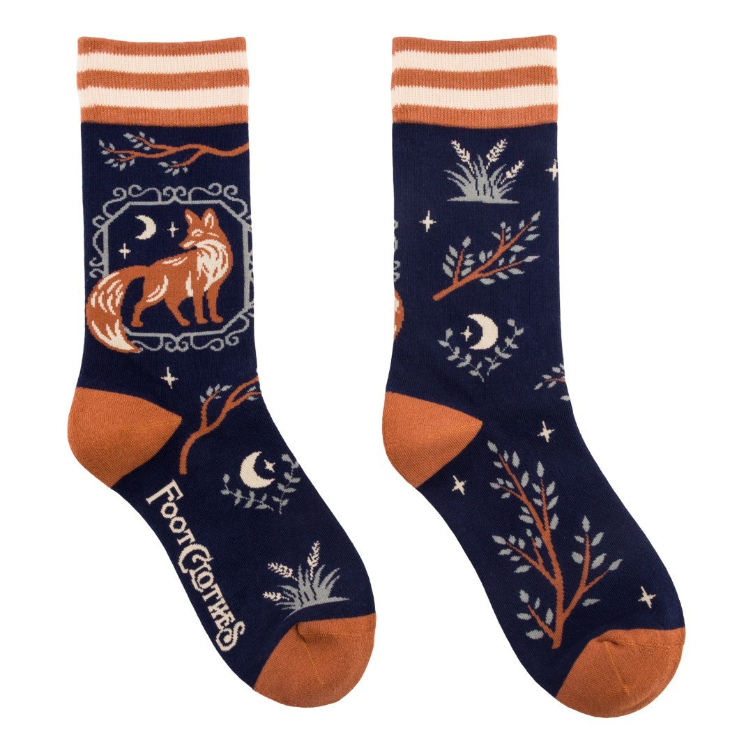 Navy blue socks with fox and moon design on a white background