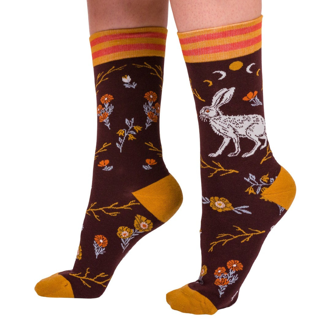 Colorful socks with floral and animal designs on a white background
