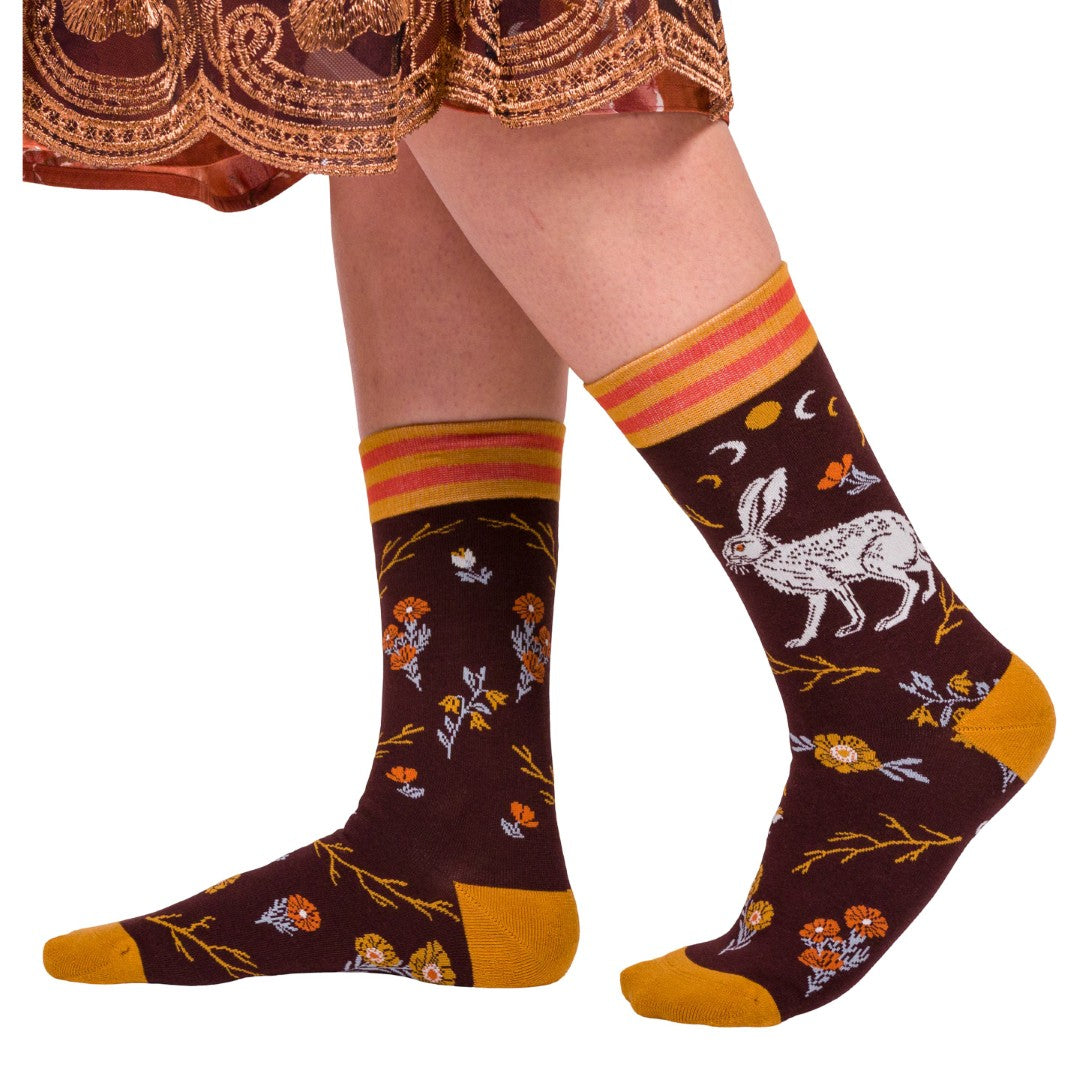 Patterned socks with animals and flowers on a white background