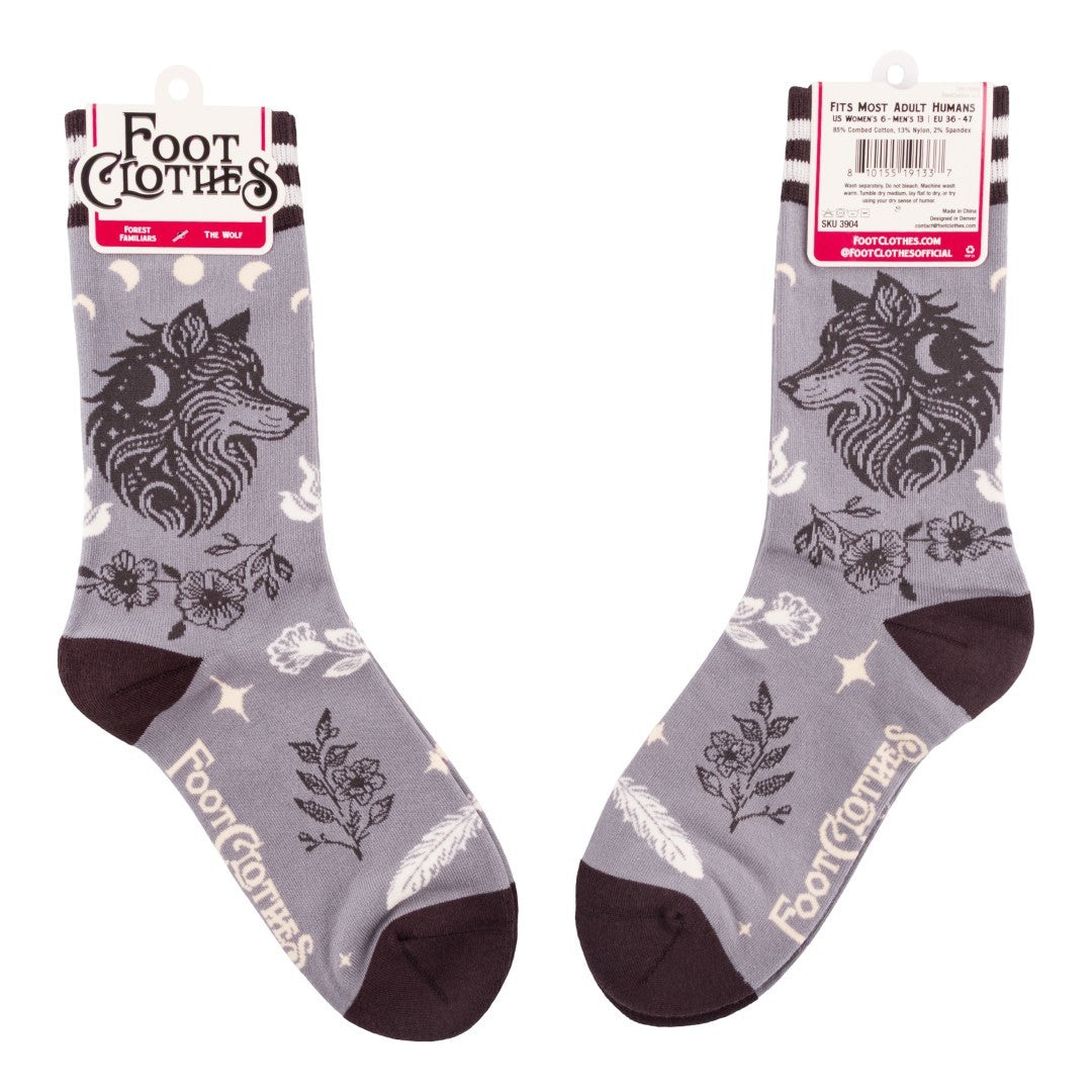 Gray socks with wolf design and floral patterns on packaging, brand 'Foot Clothes' visible.