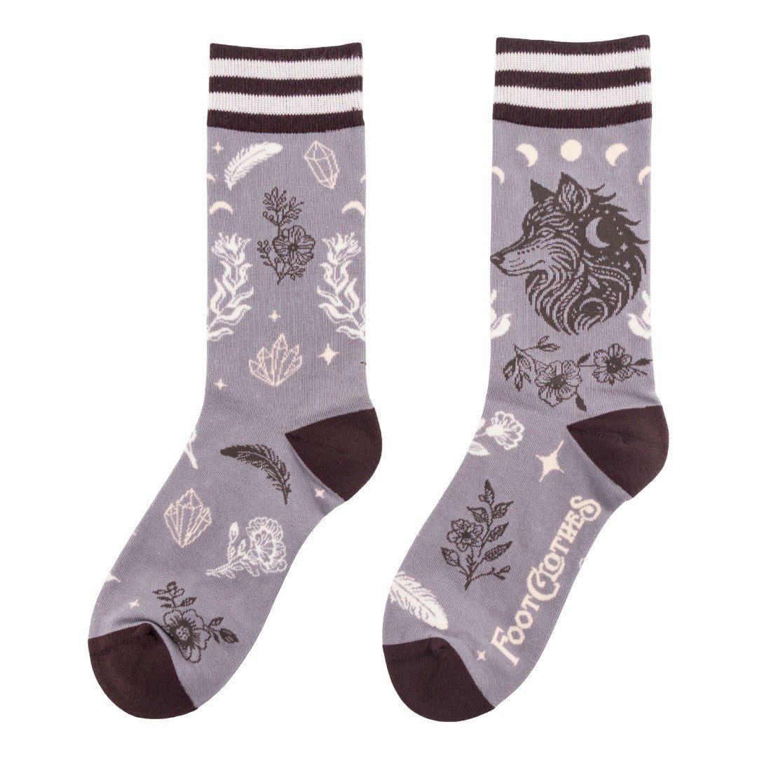 Gray socks with wolf design and white accents on a white background