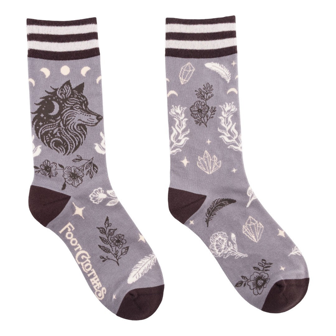 Gray socks with wolf design and white patterns on a white background