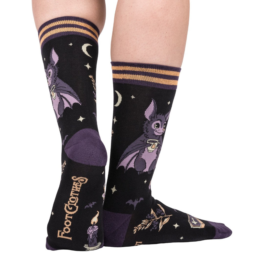 Black socks with bat design and 'Foot Clothes' branding on a white background