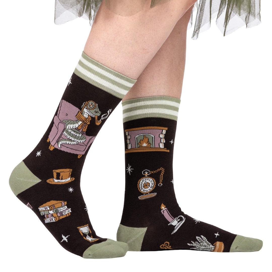 Socks with vintage-themed designs on a plain background