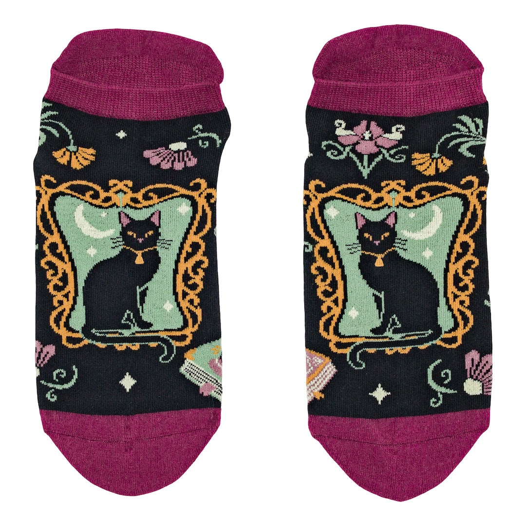 Pair of socks with a black cat design on a white background