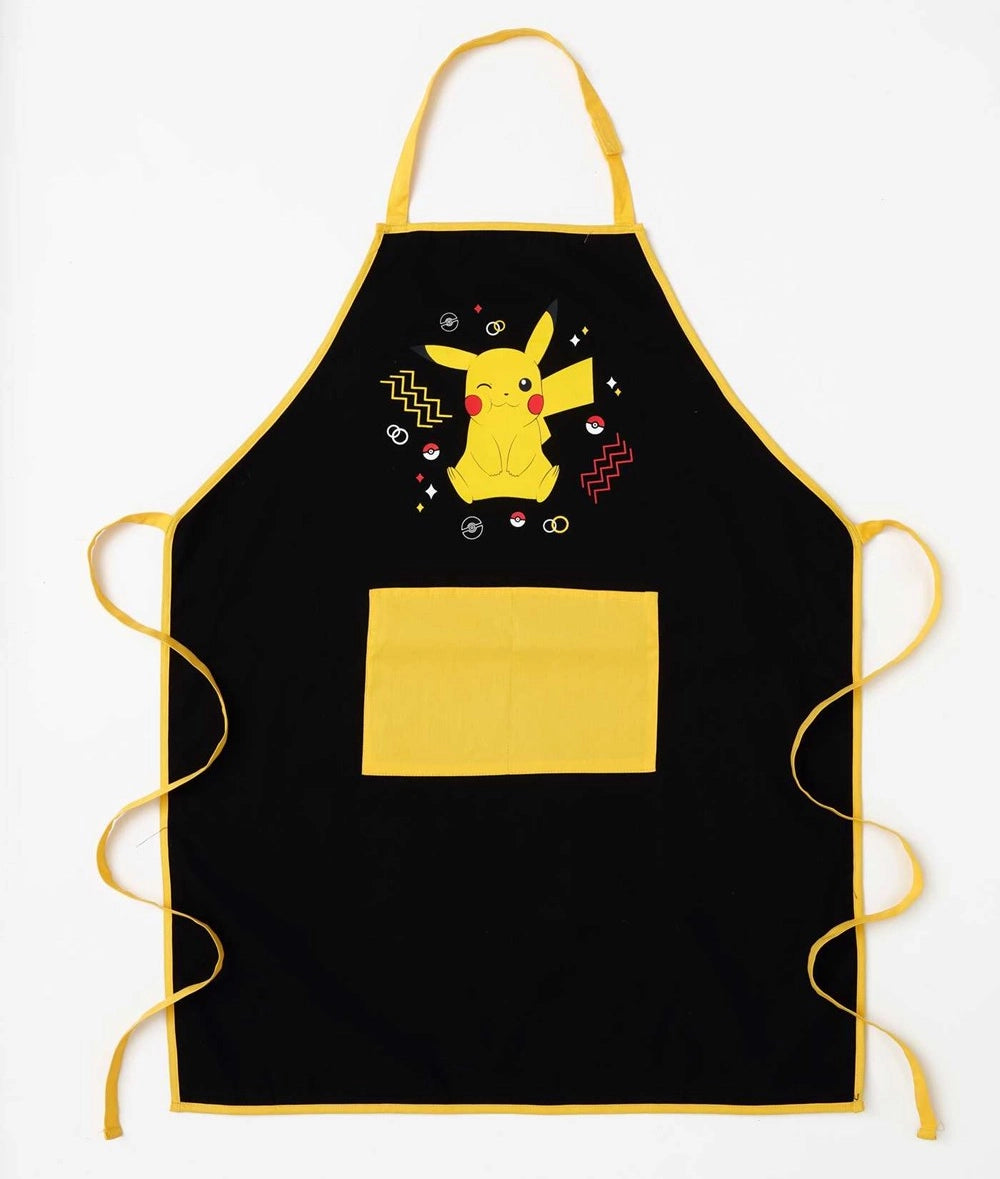 A black and yellow apron against a white background. The front of the apron has a yellow pocket, with a yellow Pikachu at the top. The apron has yellow straps.