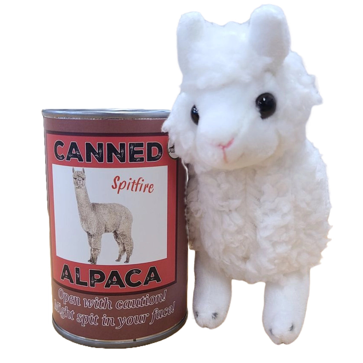 An alpaca plushie next to a brown can. The front of the can has a picture of an alpaca, with black and white text that says "canned alpaca. Open with caution! Might spit in your face!"