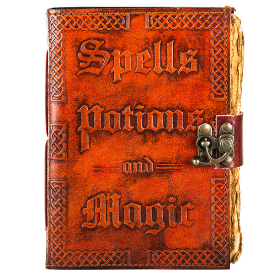 A reddish-brown, leathery journal on a white background. The front cover has raised text saying "spells, potions, and magic." At the right side is a metal locking clasp, securing the book shut. Ragged, antique-looking pages are visible at the edge.