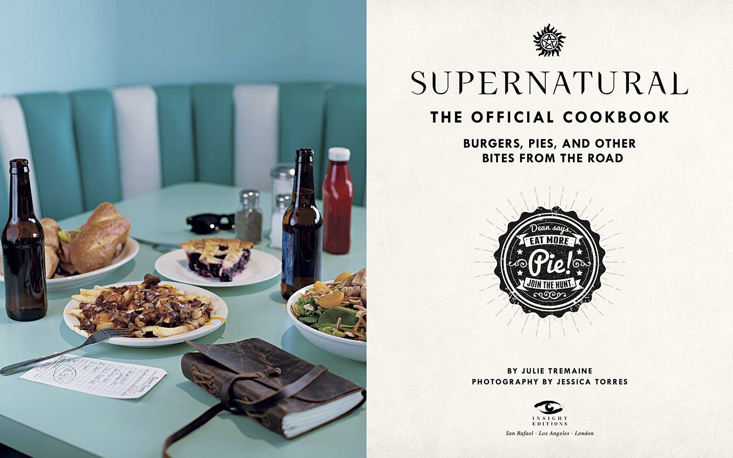 Load image into Gallery viewer, A two-page spread from the book. On the left are half-eaten meals on a light blue diner table, with beer bottles and a Hunter&amp;#39;s journal next to the plates. On the right is the title page from the book, with black text saying &amp;quot;supernatural, the official cookbook: burgers, pies, and other bites from the road.&amp;quot;
