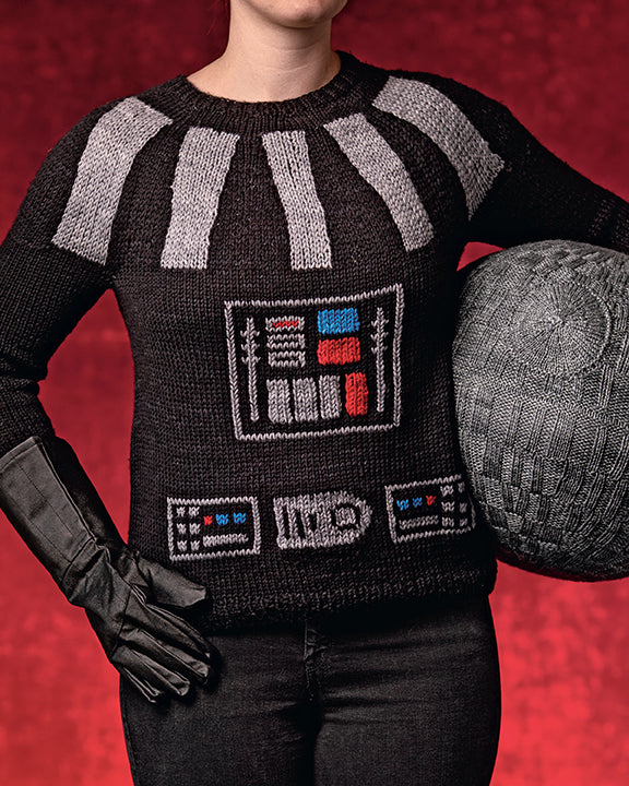 A woman wearing a knit black sweater, fashioned after the costume worn by Darth Vader from the Star Wars movies.