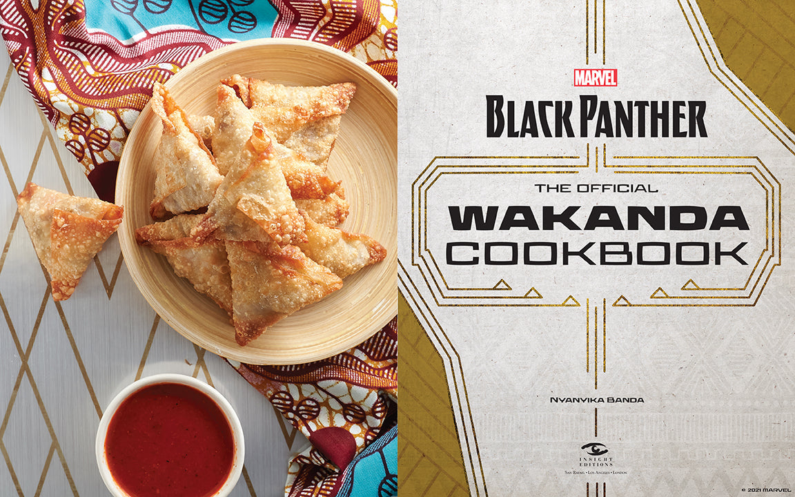 Black Panther Wakanda Cookbook with samosas and dipping sauce on a decorative tablecloth