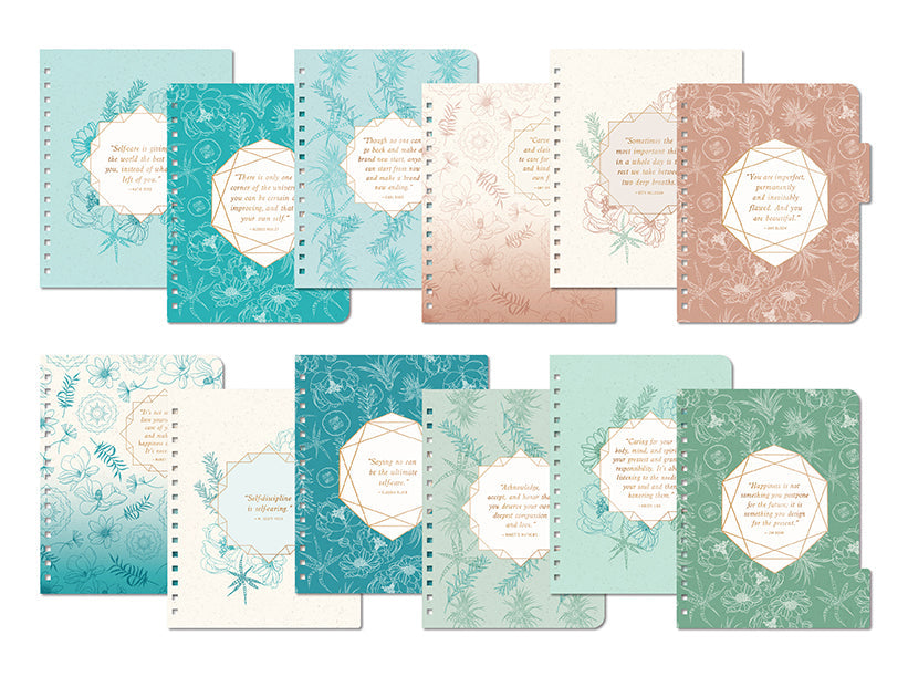 Set of decorative notebooks with floral and text patterns on a white background