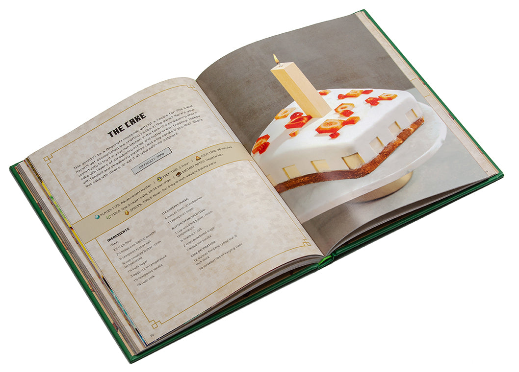 Open book showing a recipe for a cake with a candle on a white background