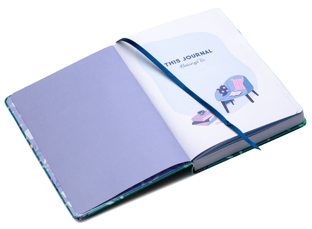 Open journal with a purple interior and blue ribbon, featuring illustrations on the cover.