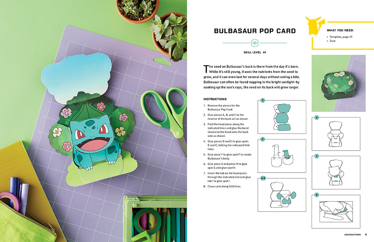 Bulbasaur pop card craft project with scissors and materials on a green surface