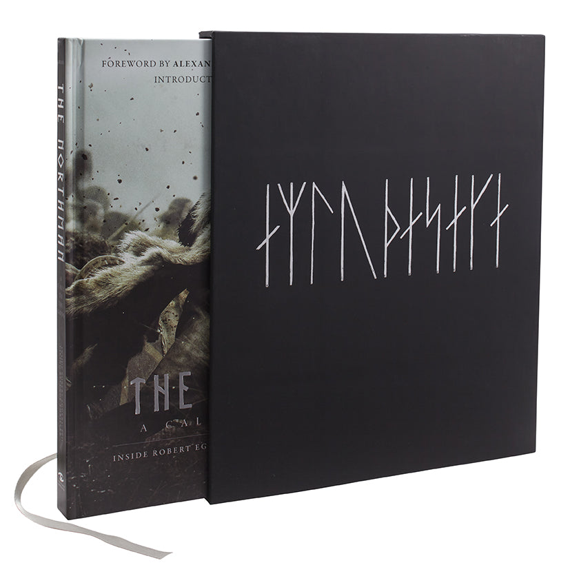 Two books, one with a dark cover and the other with a black cover featuring white text, on a white background.