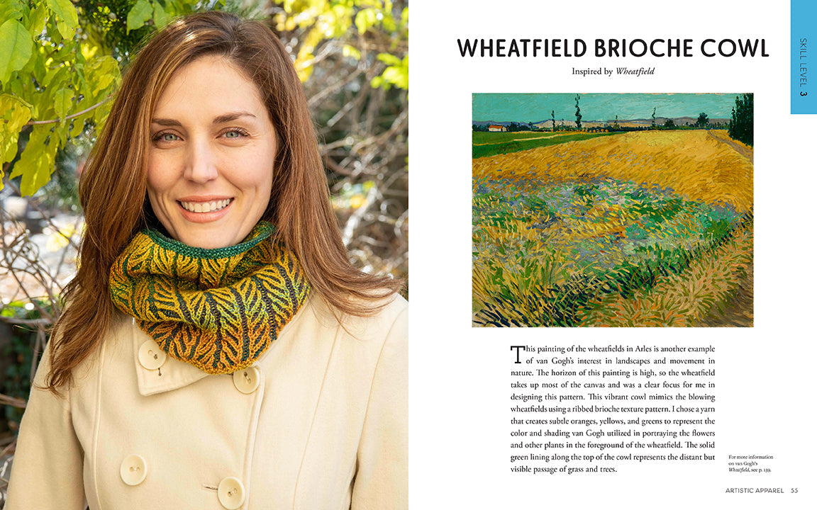 Woman wearing a knitted cowl with a scenic painting of a wheatfield.