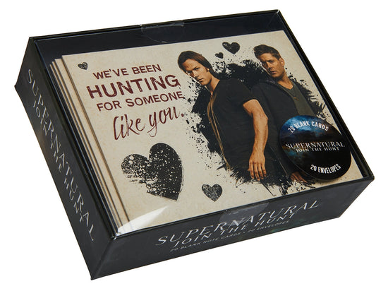 A box of notecard-style Valentine's cards. The top one shows Sam and Dean on the front and reads "We've been hunting for someone like you"