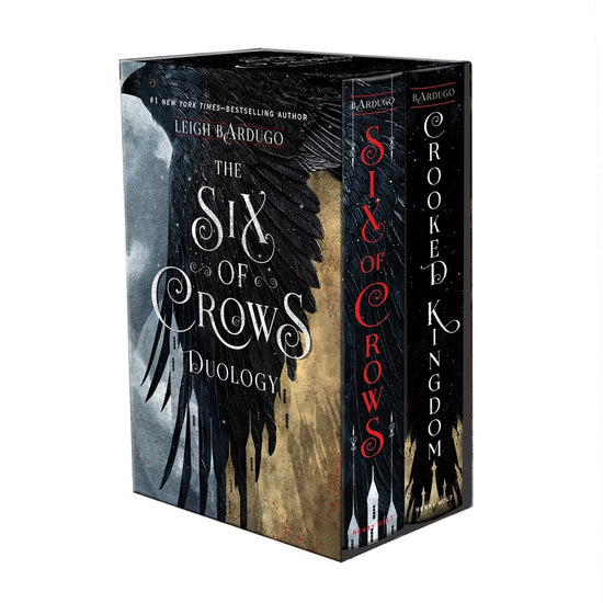 Load image into Gallery viewer, A paperback boxed set of the Six of Crows and Crooked Kingdoms books, with a matching slipcase displaying the series and author name over a large crow illustration.
