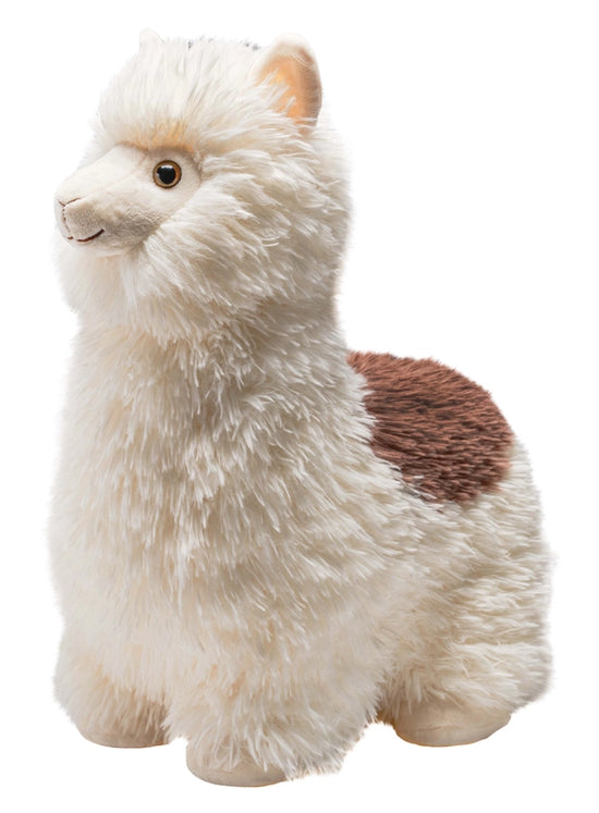 Close up view of a stuffed, smiling alpaca against a white background. The alpaca is white, with a patch of brown fur on its back. 