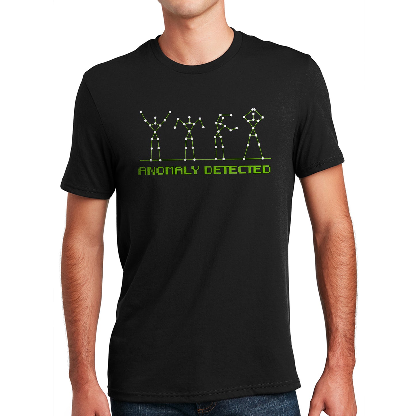 A male model in a black unisex shirt. It reads "anomaly detected" in green 'digital' text. Above it are 4 figures standing on a thing green line. The figures are made out of thin green lines with white dot markers meant to resemble a chart reading, but they're forming the shapes of the 'YMCA' dance.