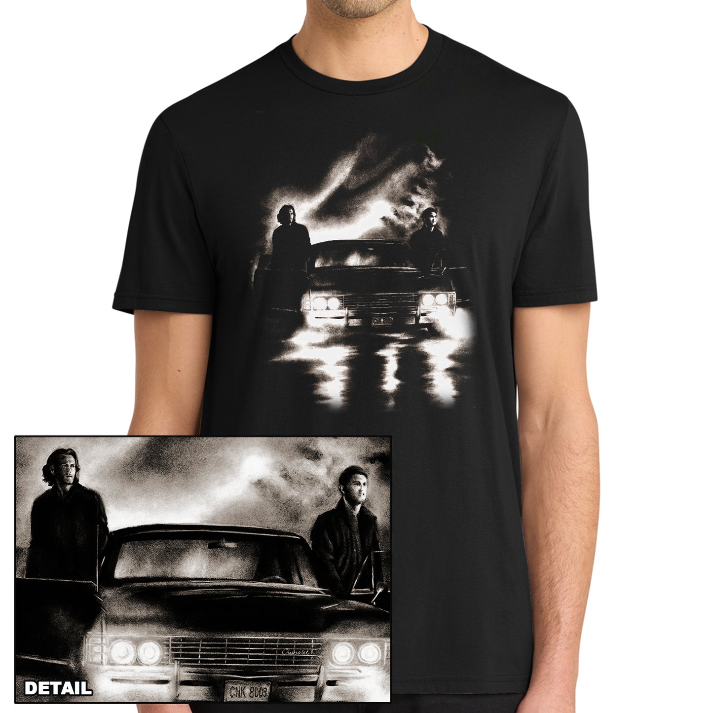 A model in a black tee shirt. On the front is a drawing of Sam and Dean Winchester with Baby. Inset is a close up of the drawing.