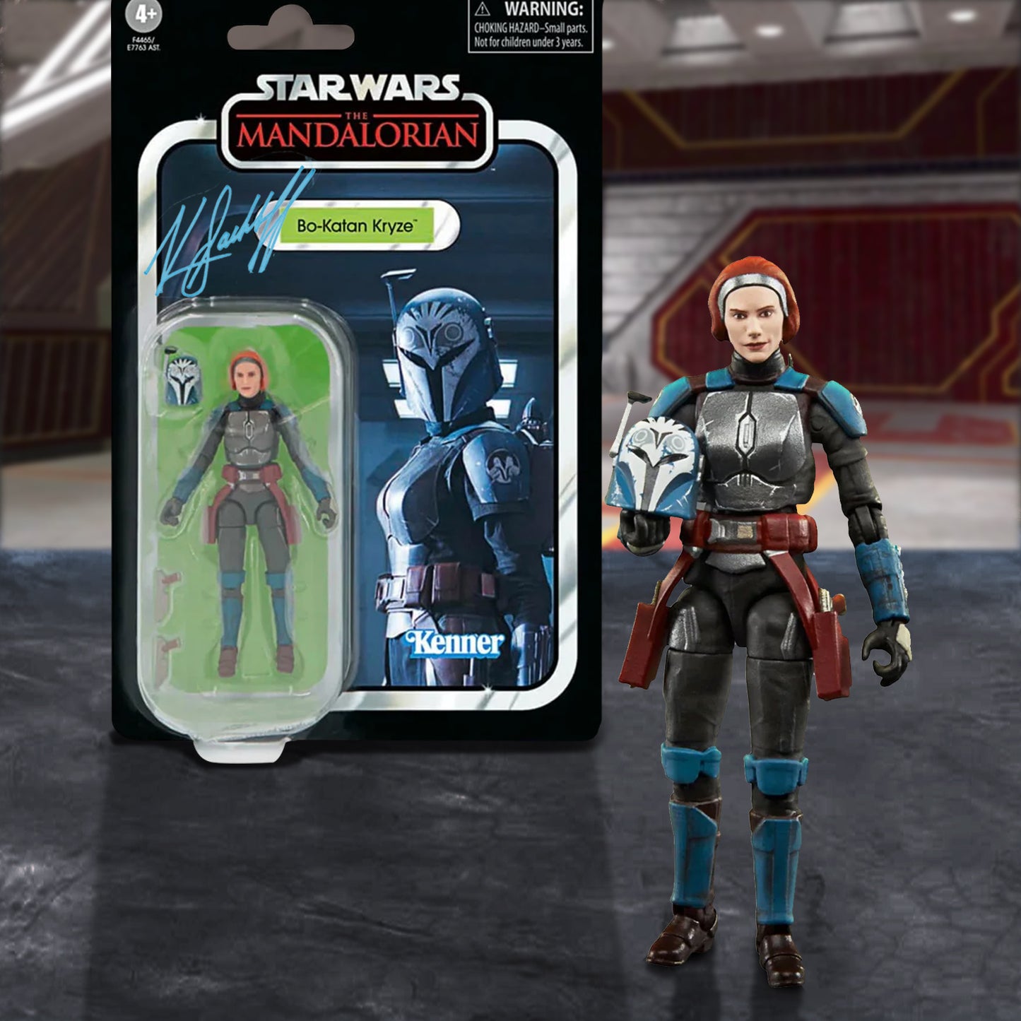 Star Wars Bo -Katan Kryze action figure with packaging on a dark surface. It is signed by Katee Sackhoff.