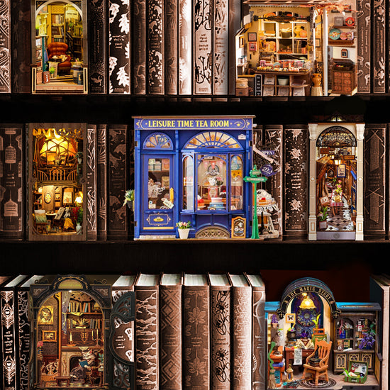 A bookshelf filled with books and various book nook kits.