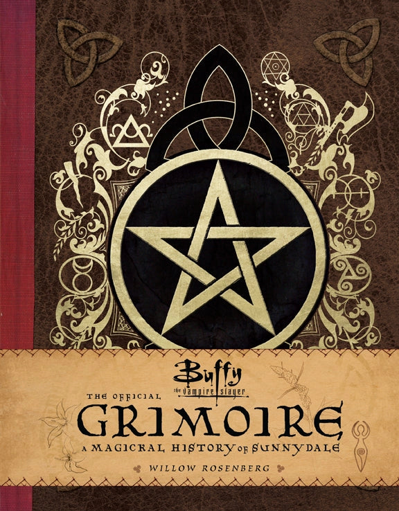 A hardcover book with a gold and black pentagram on the front cover. A brown band across the bottom says "Buffy the Vampire Slayer: The Official Grimoire."