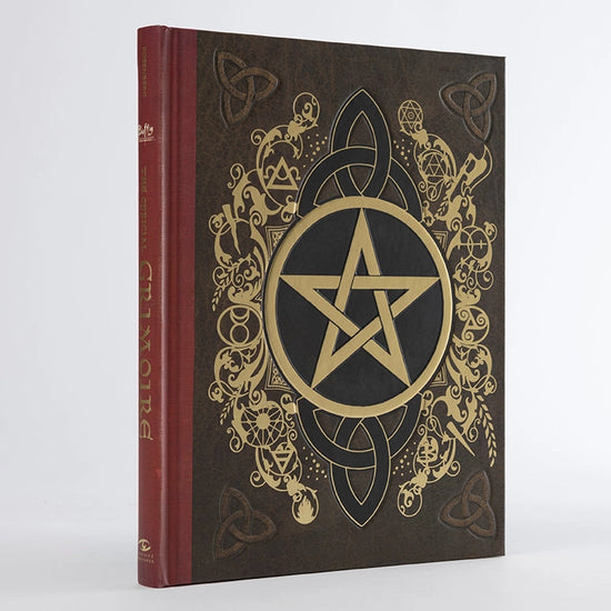 A hardcover book with a gold and black pentagram on the front cover.