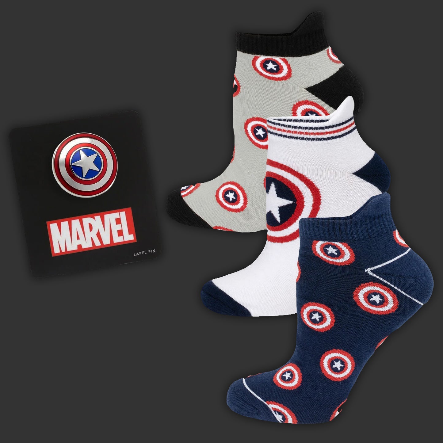 Set of socks with Captain America design and Marvel lapel pin on a dark background