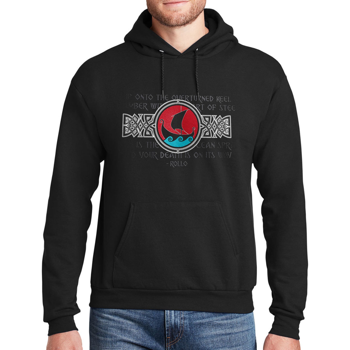 A black hoodie. The design features a red circle containing a black viking ship sillhouette and blue ocean waves. On either side of the circle is a black and white rectangular Viking-style filigree design. In the background in a faded black-on-black font is the "overturned keel" Rollo quote. 