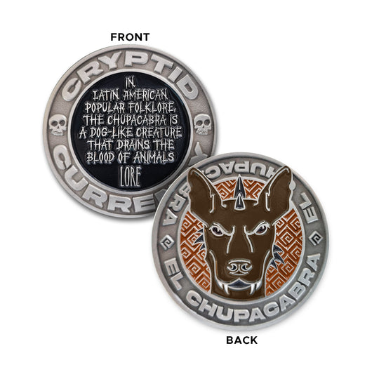Load image into Gallery viewer, A silver challenge coin. One side features the words &amp;quot;CRYPTID CURRENCY&amp;quot; and two small skulls around the edge, with a black circle containing the words “In Latin American popular folklore, the Chupacabra is a dog-like creature that drains the blood of animals” and &amp;quot;LORE&amp;quot; in silver. The other side features the words &amp;quot; EL CHUPACABRA &amp;quot;  twice around the edge, with a red circle containing geometric lines and a brown Chupacabra face.
