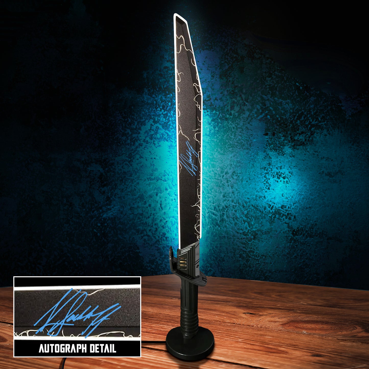 An LED Lamp depicting the Darksaber from "The Mandalorian" series. Inset in the corner is Katee Sackhoff's autograph